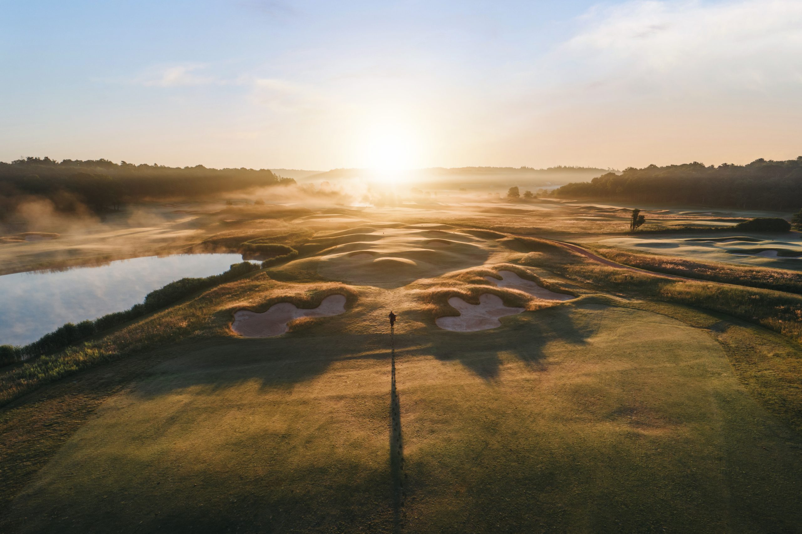 An aerial view of Vallda golf course, with water and bunkers.